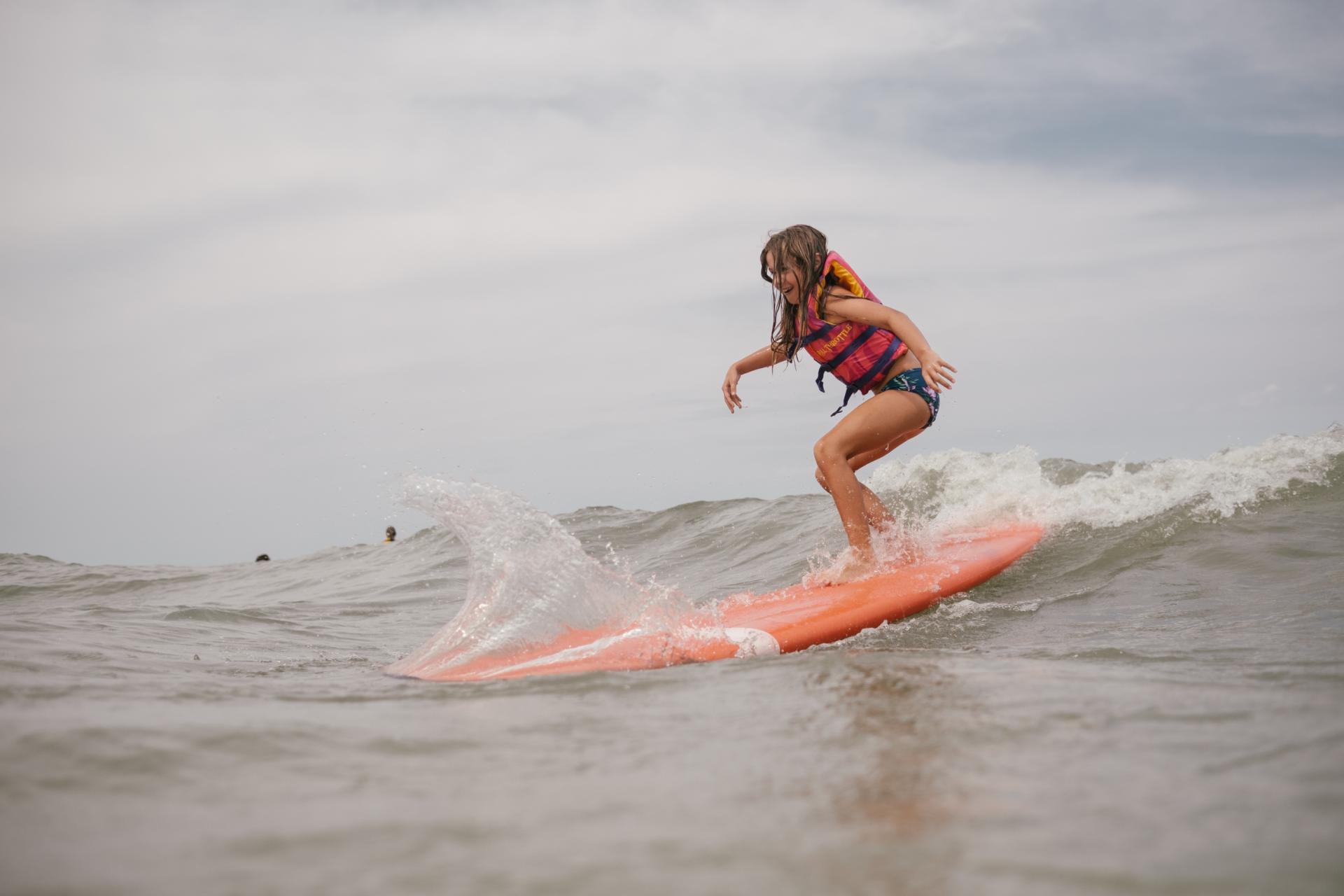 Catching our first waves on Lake Michigan at beach camp