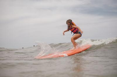 Catching our first waves on Lake Michigan at beach camp