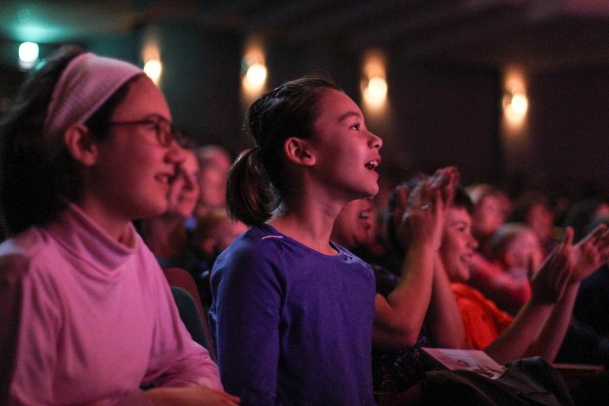Audience members enjoying performance on the Mendel Center Mainstage