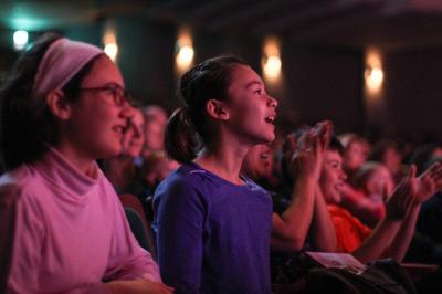 Audience members enjoying performance on the Mendel Center Mainstage
