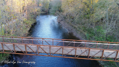 Overhead view of river and pedestrian bridge to island