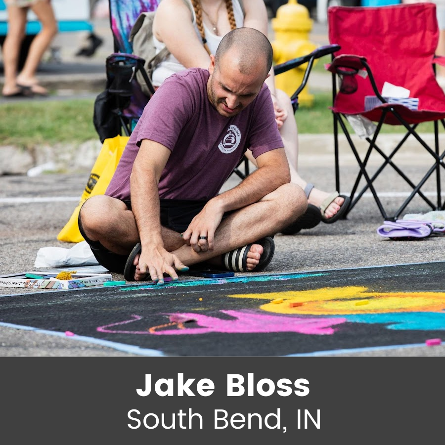 Artist working on chalk art piece