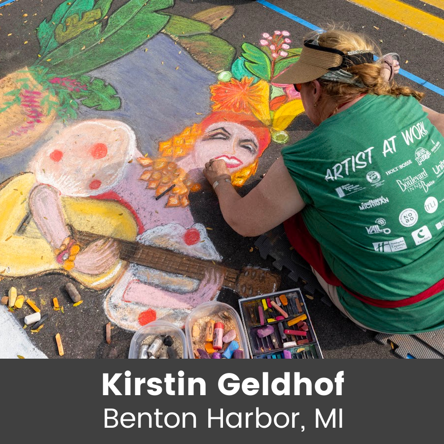 Artist working on colorful chalk art piece