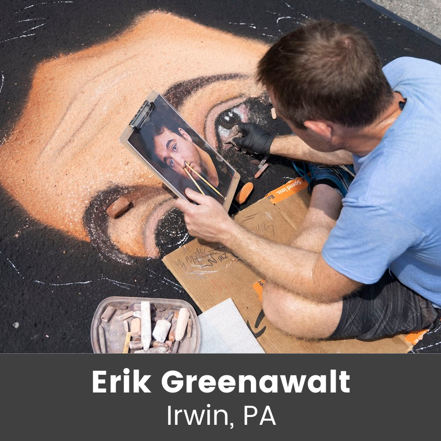 Artist working on chalk art piece