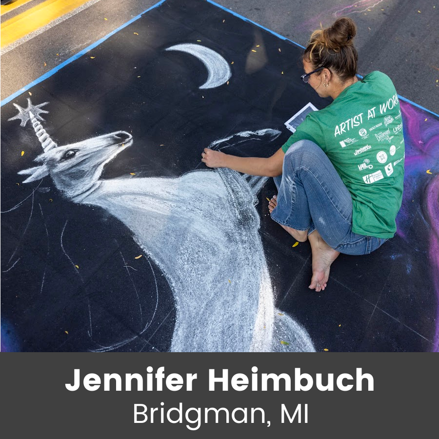 Artist working on chalk art piece