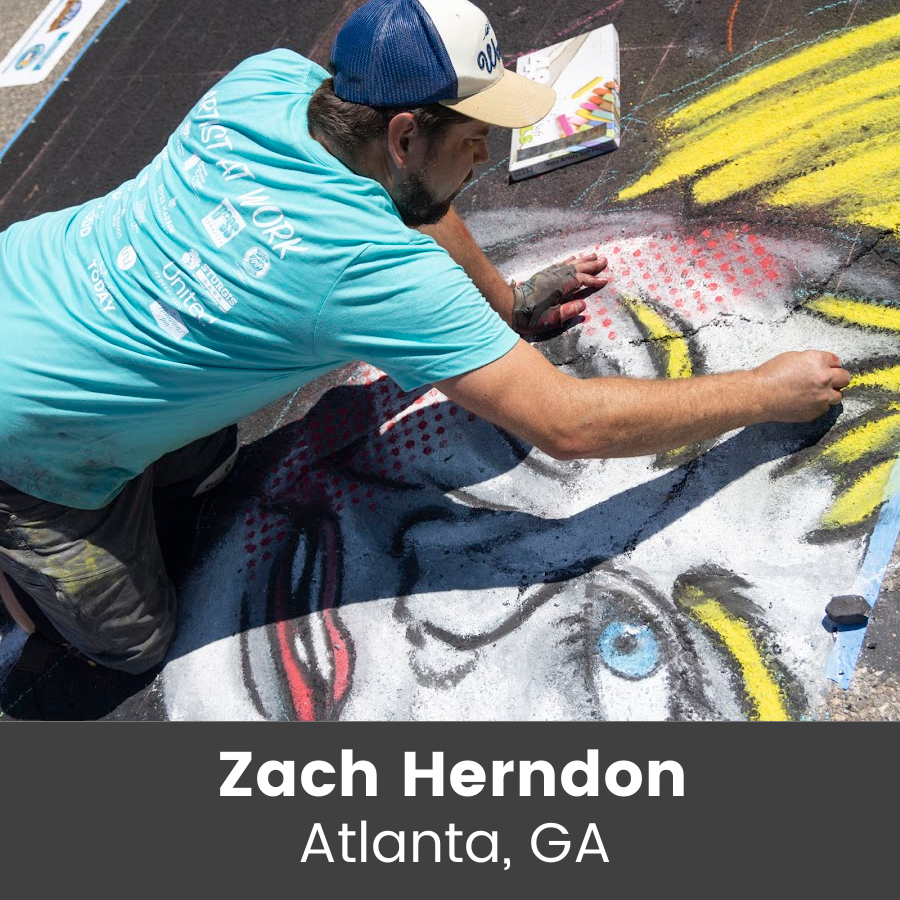Artist working on chalk art piece