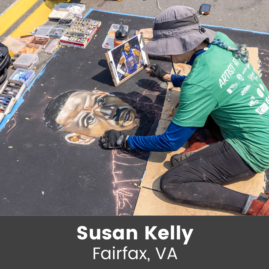 Artist working on chalk art piece