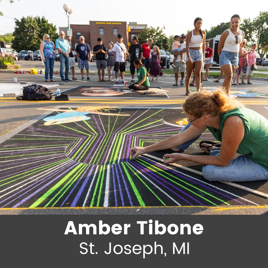 Artist working on chalk art piece