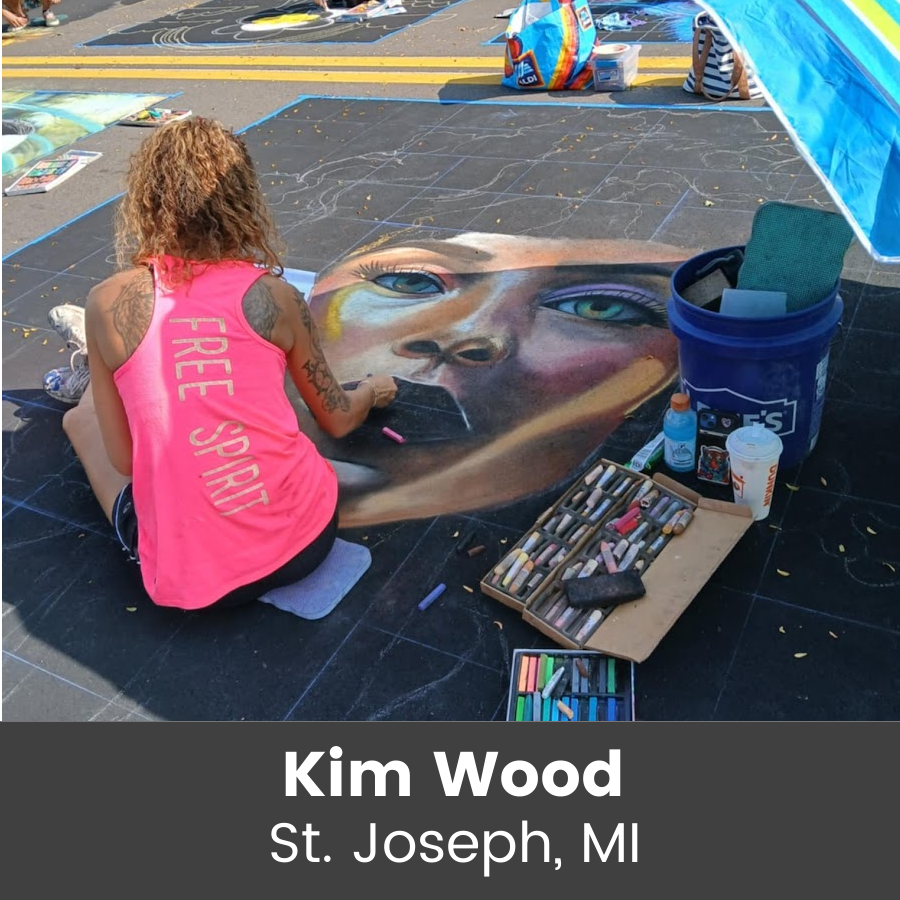 Artist working on chalk art piece