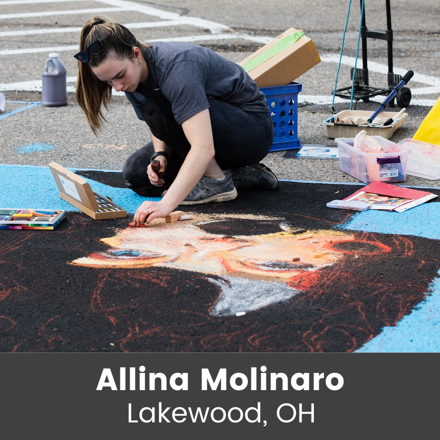 Artist working on chalk art piece