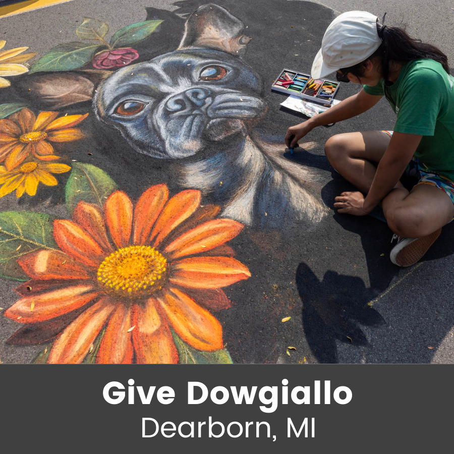 Artist working on chalk art piece
