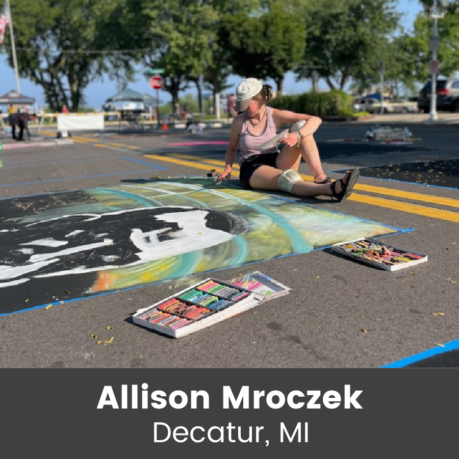 Artist working on chalk art piece