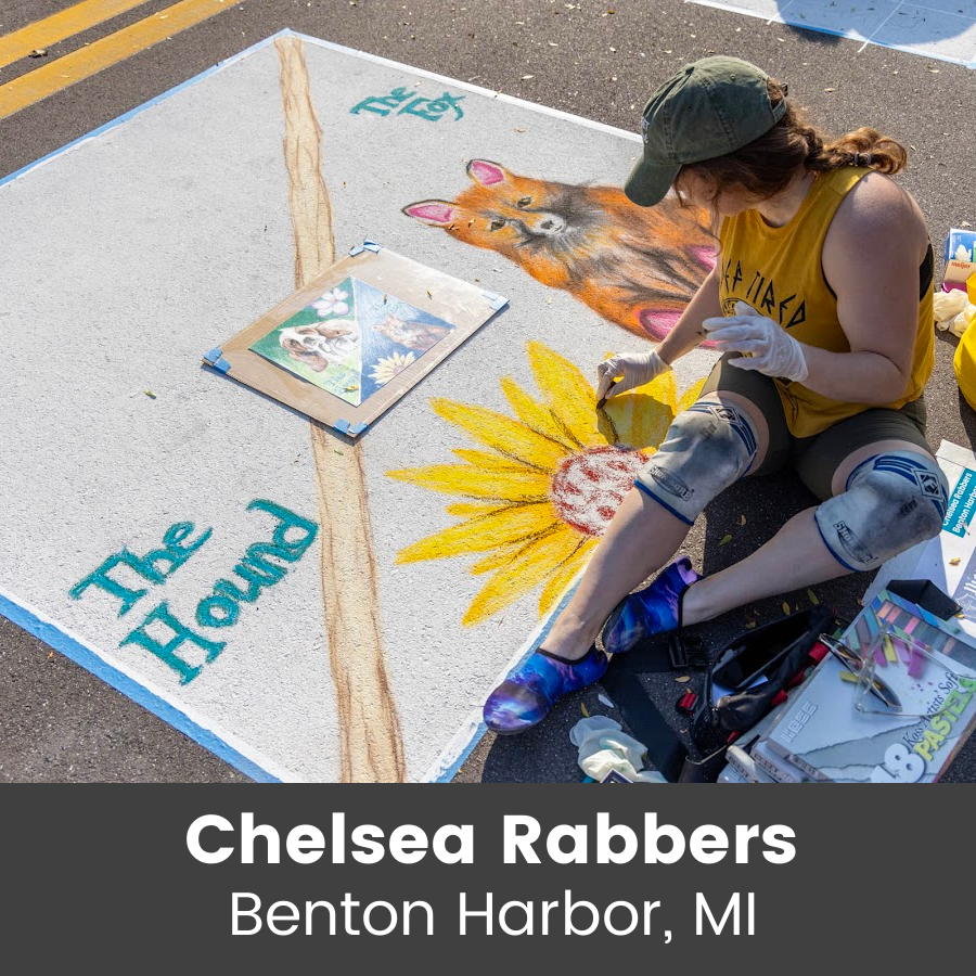 Artist working on chalk art piece